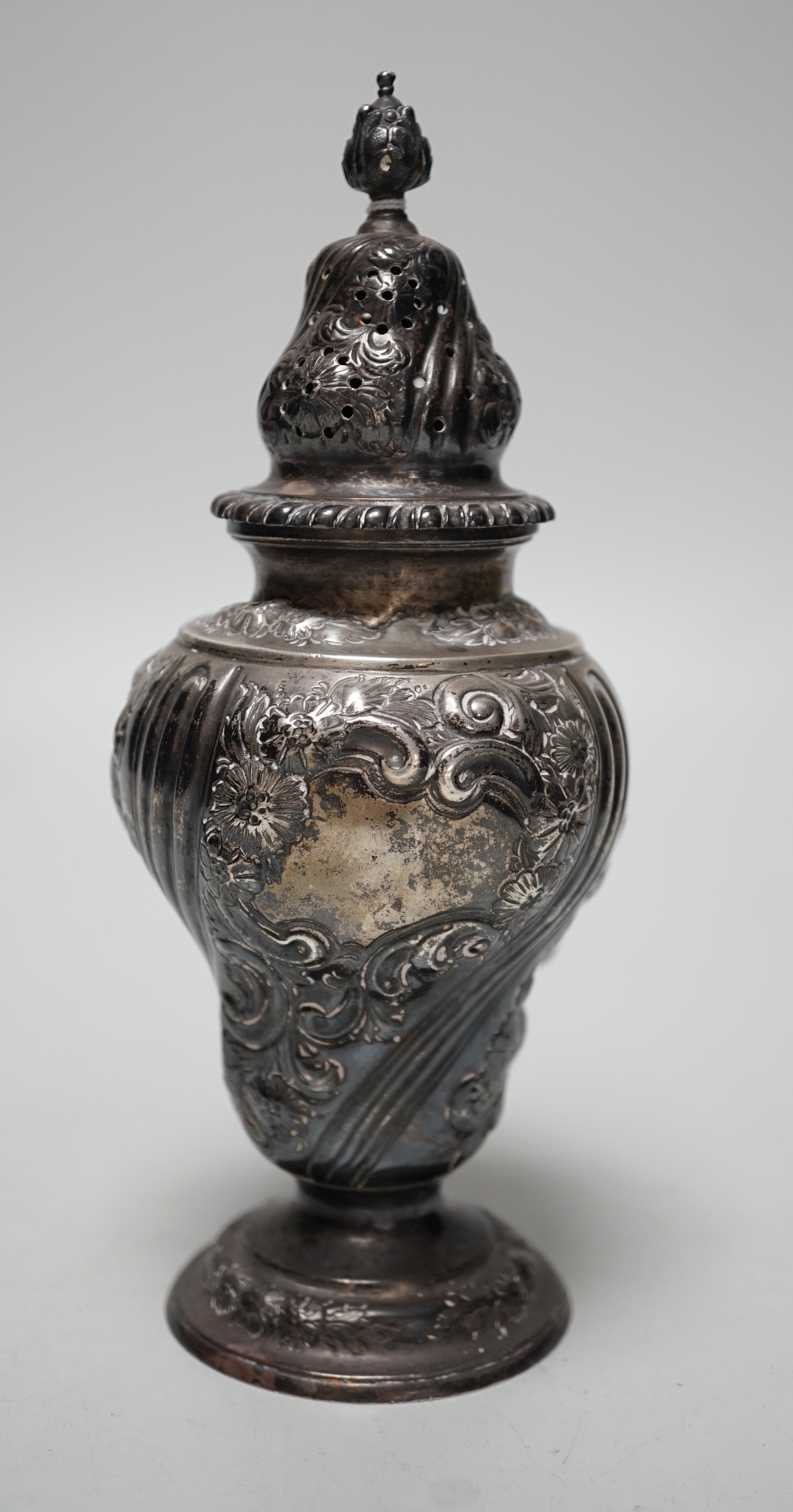 A late Victorian embossed silver inverted pear shaped sugar caster, Harris Brothers, London, 1897, 19.8cm, 7.5oz.